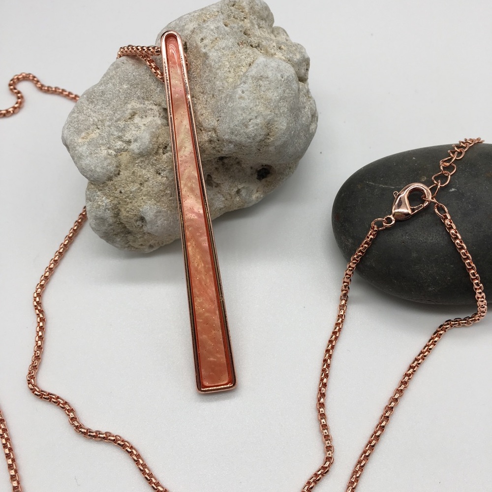 Rose-gold toned with iridescent peach pendant